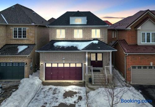 Welcoming brick home with garage and cozy evening curb appeal