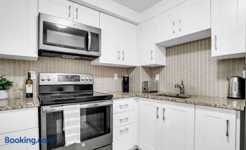 Bright modern kitchen with granite counters and stainless appliances