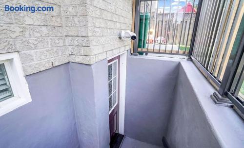 Private lower-level entry with secure gated stairwell access