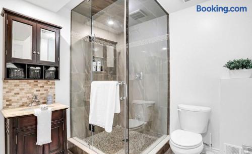 Modern bathroom with glass walk-in shower and stylish wood vanity