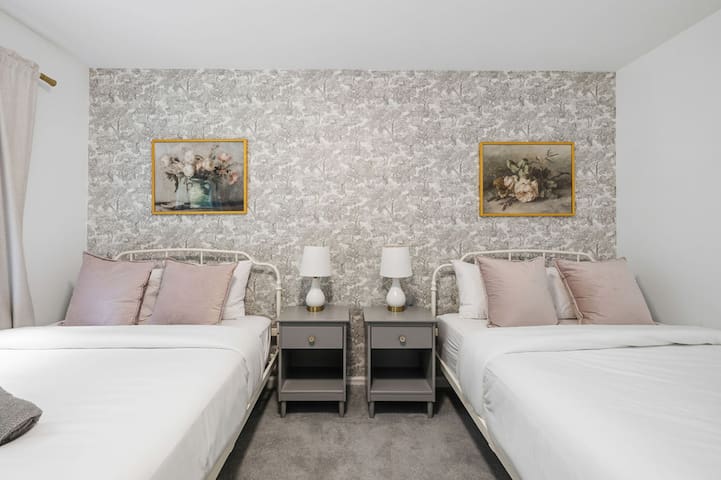 Bright double bedroom with stylish decor and cozy hotel-style touches