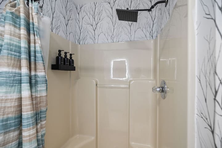 Stylish walk-in shower with rainfall head and spa-like modern touches