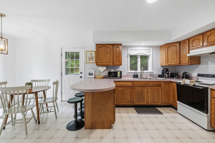 Bright eat-in kitchen with bar seating and plenty of prep space
