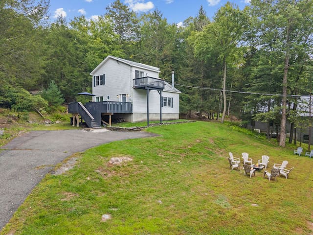 Private woodland retreat with decks, fire pit, and spacious yard