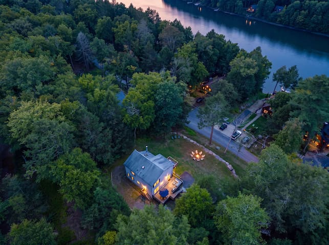 Secluded lake-area cabin with forest views, deck, and fire pit