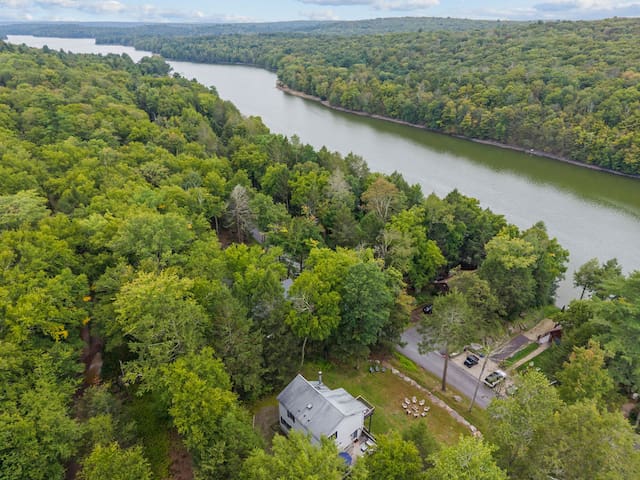 Secluded riverfront retreat surrounded by trees and scenic views