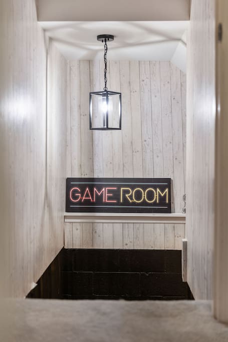 Stylish stairwell leading to a fun, dedicated game room