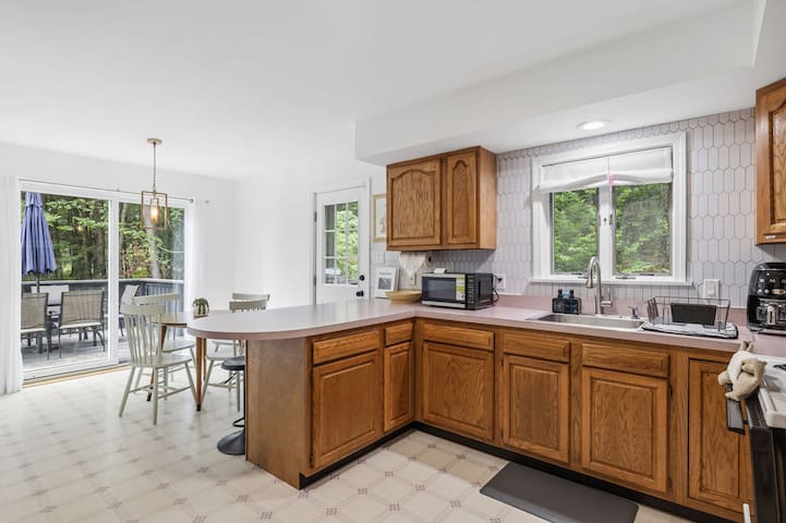 Bright kitchen with breakfast bar and easy access to the outdoor patio