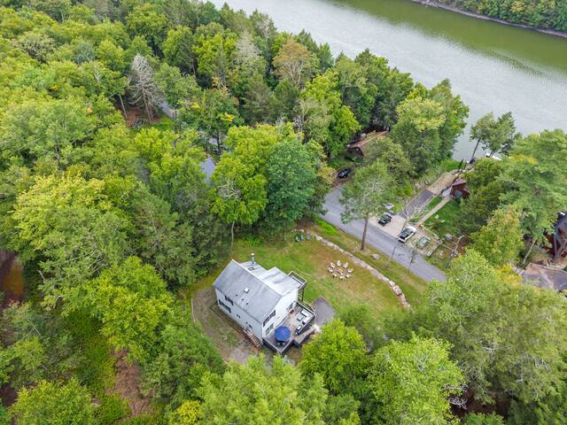 Secluded woodland retreat near the water with yard and outdoor deck
