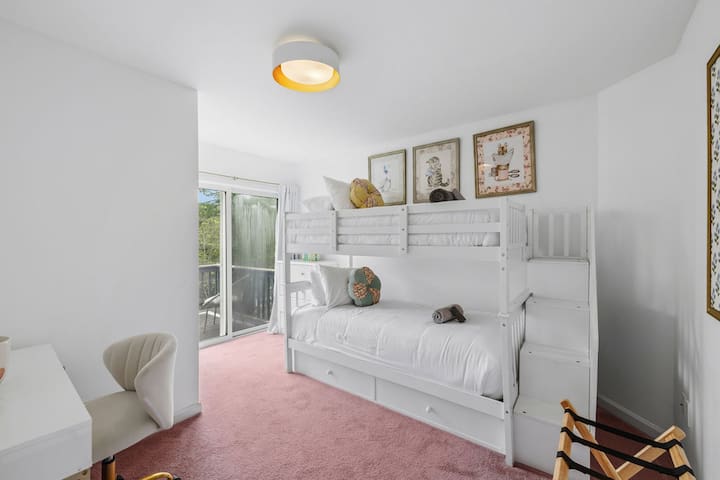 Bright bunk room with balcony access and family-friendly sleeping space