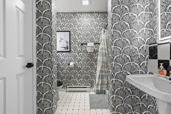 Stylish patterned bathroom with bright finishes and a fresh, modern feel