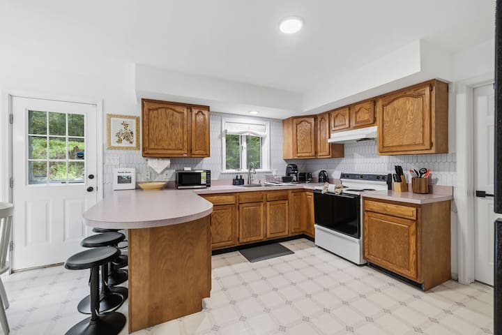 Bright, spacious kitchen with breakfast bar and plenty of prep space
