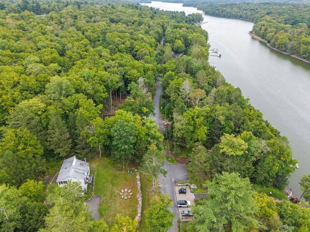 Private riverside retreat surrounded by trees and peaceful natural beauty