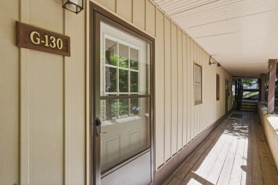 Covered exterior entry with private front door and easy unit access