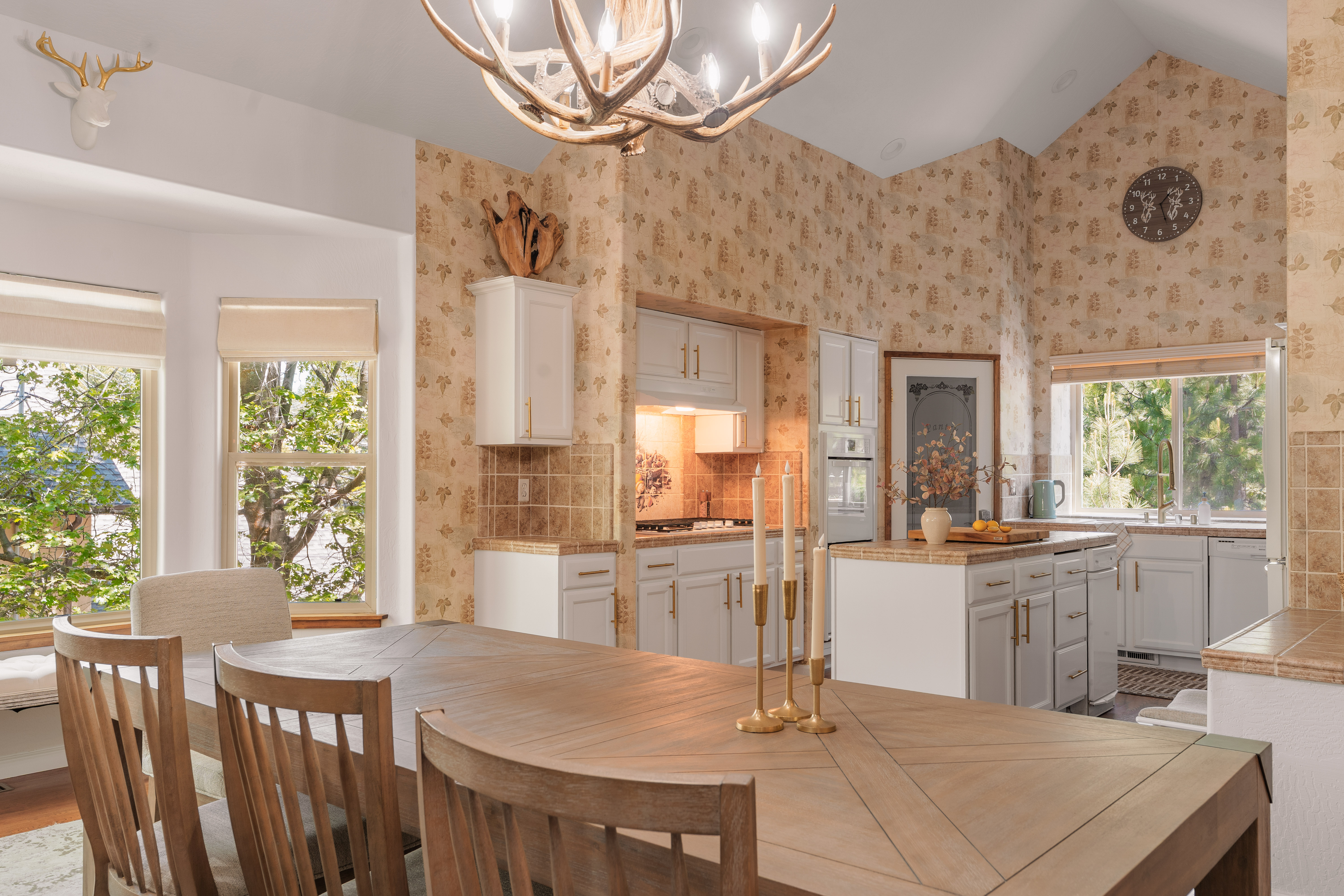 Bright vaulted kitchen with rustic charm, island, and sunny dining area