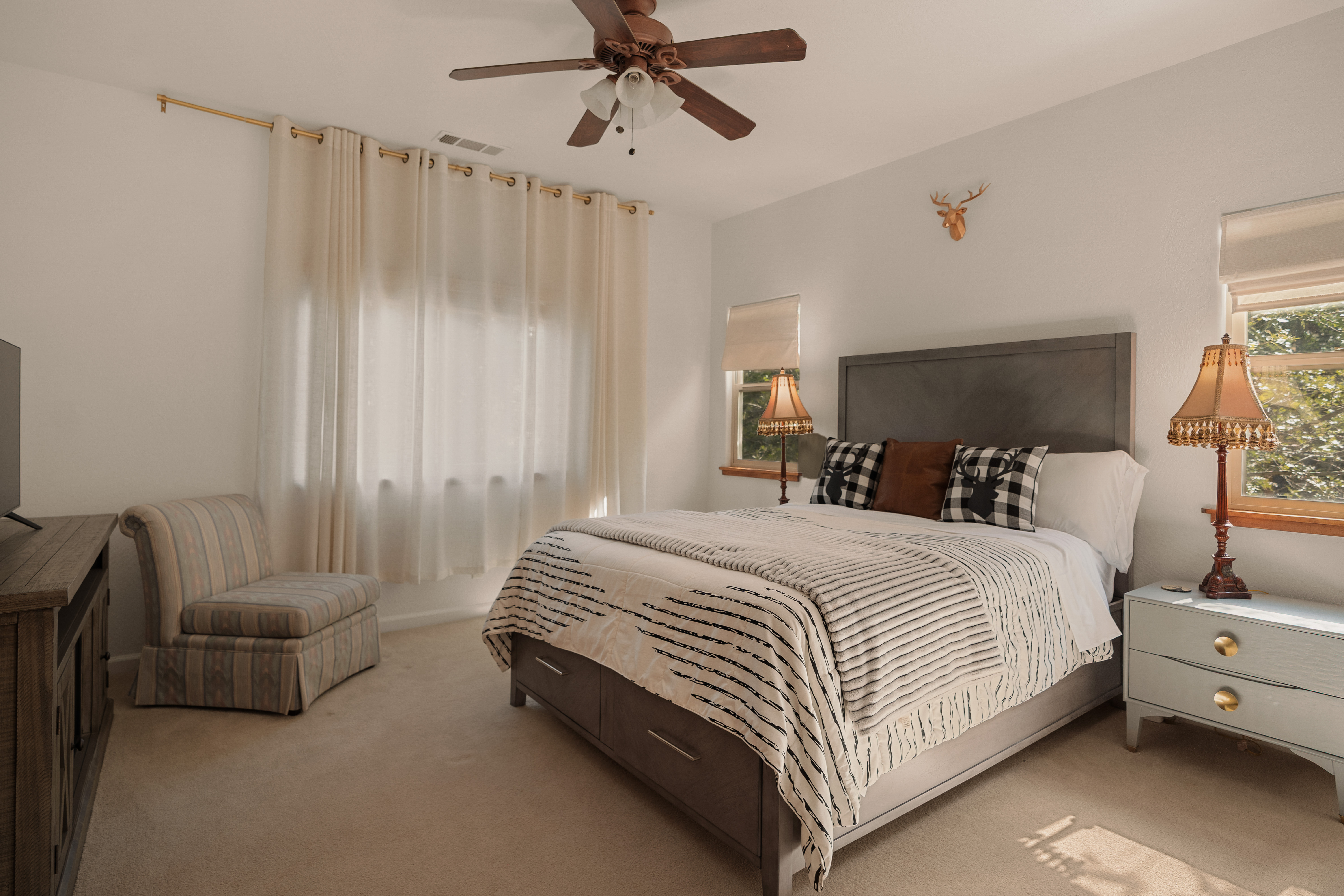 Bright, cozy bedroom with soft natural light and rustic charm