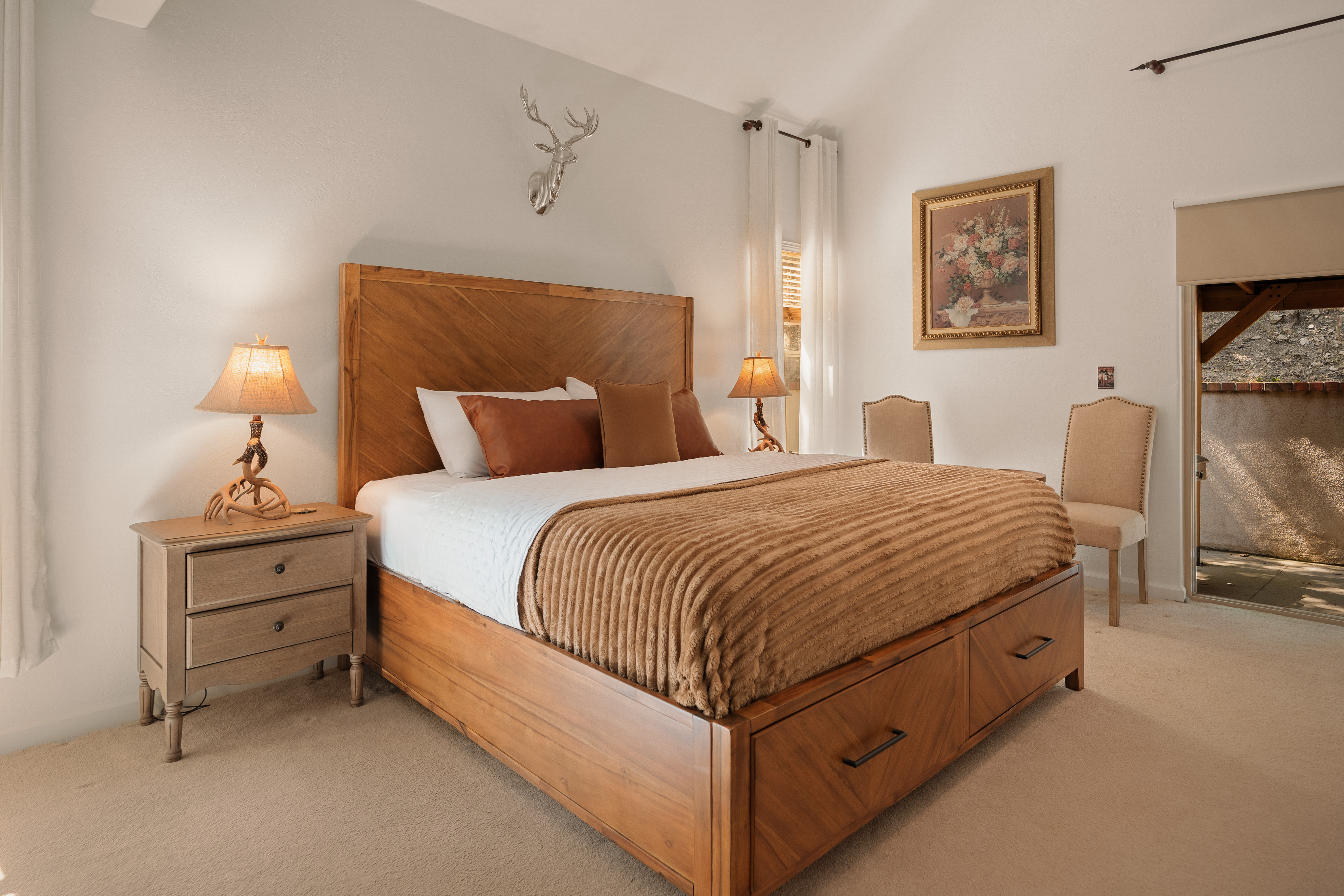 Warm, spacious bedroom with king bed and inviting rustic touches
