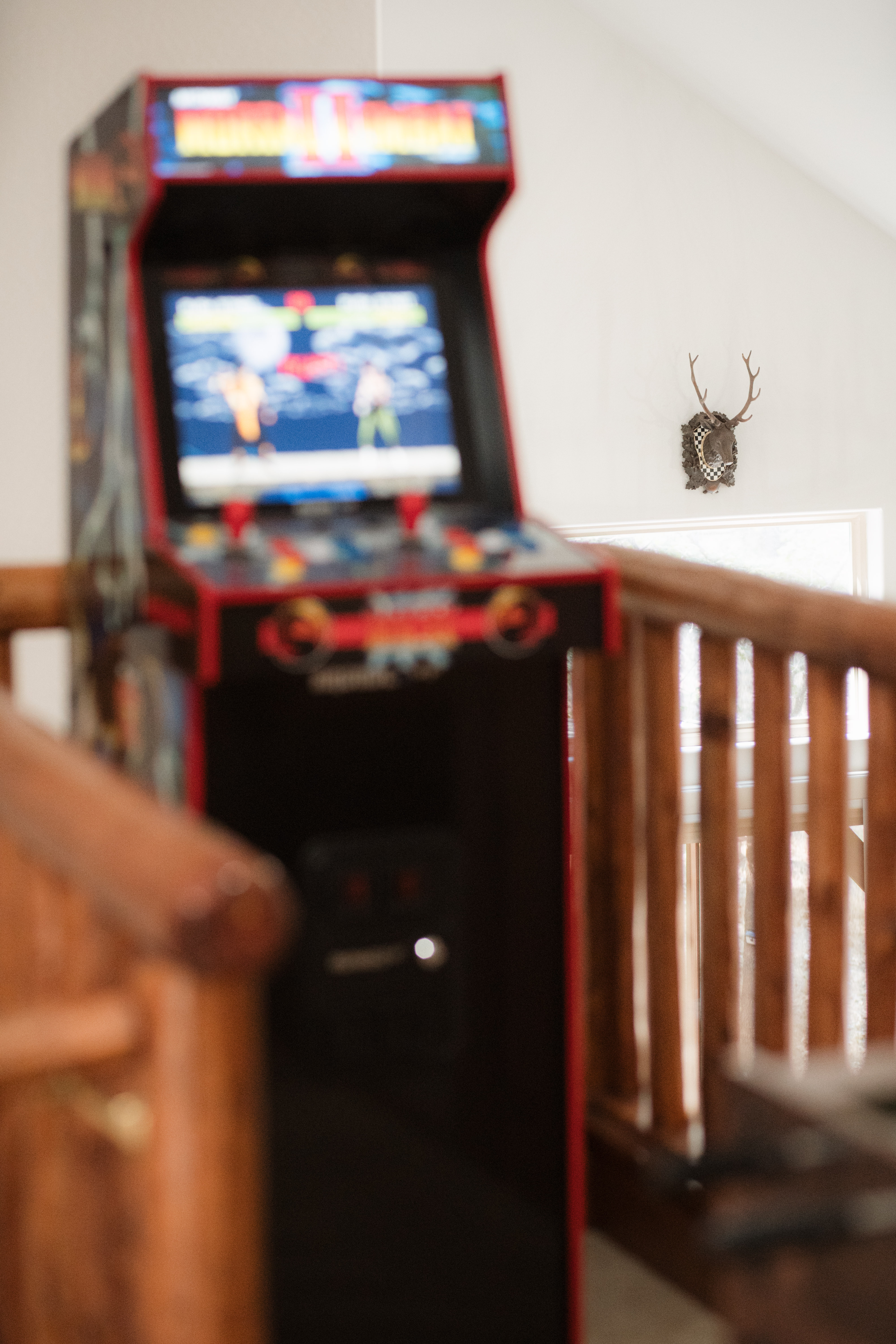 Retro arcade game adds a fun bonus hangout spot with cozy cabin charm