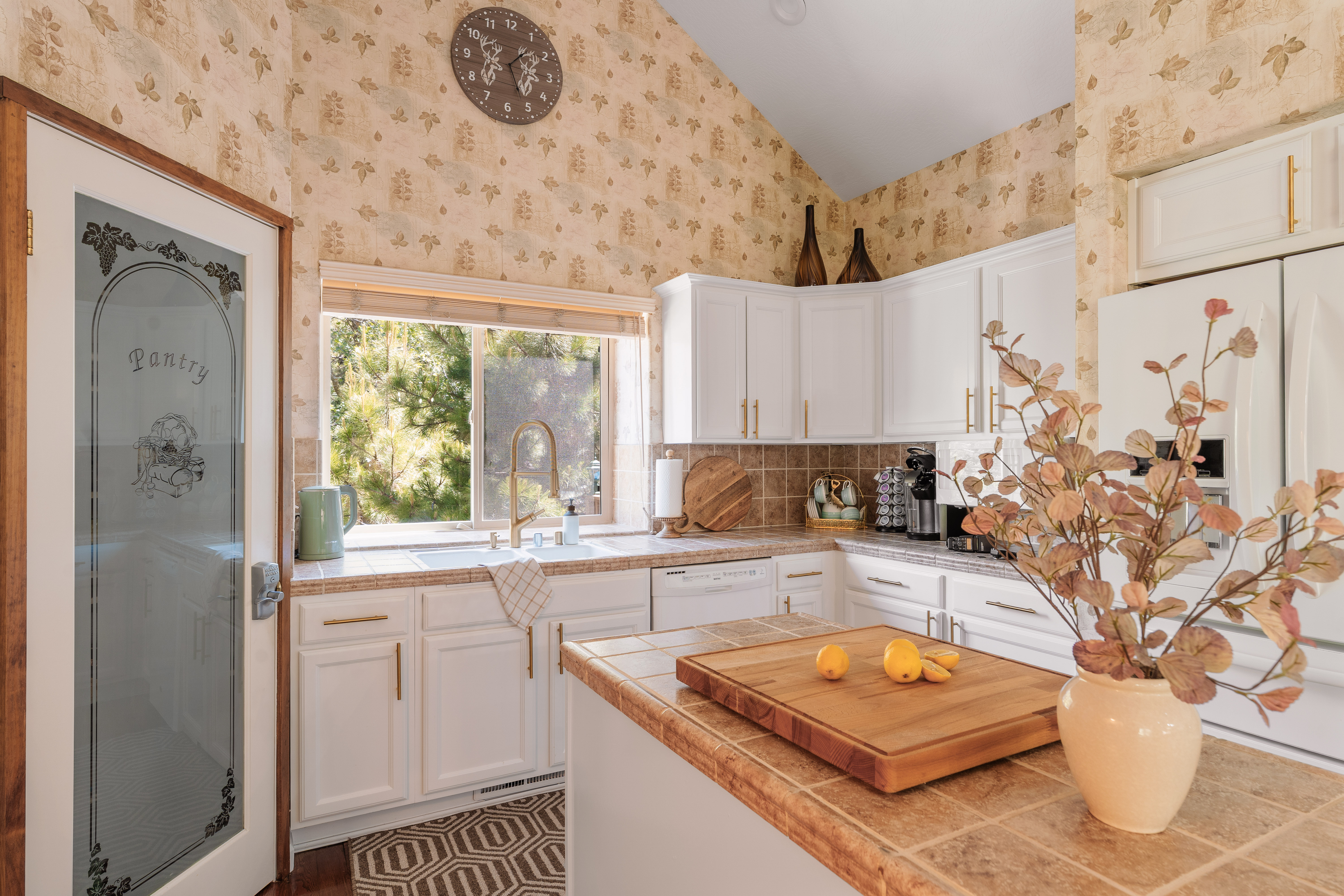 Charming sunlit kitchen with vaulted ceilings and warm rustic touches