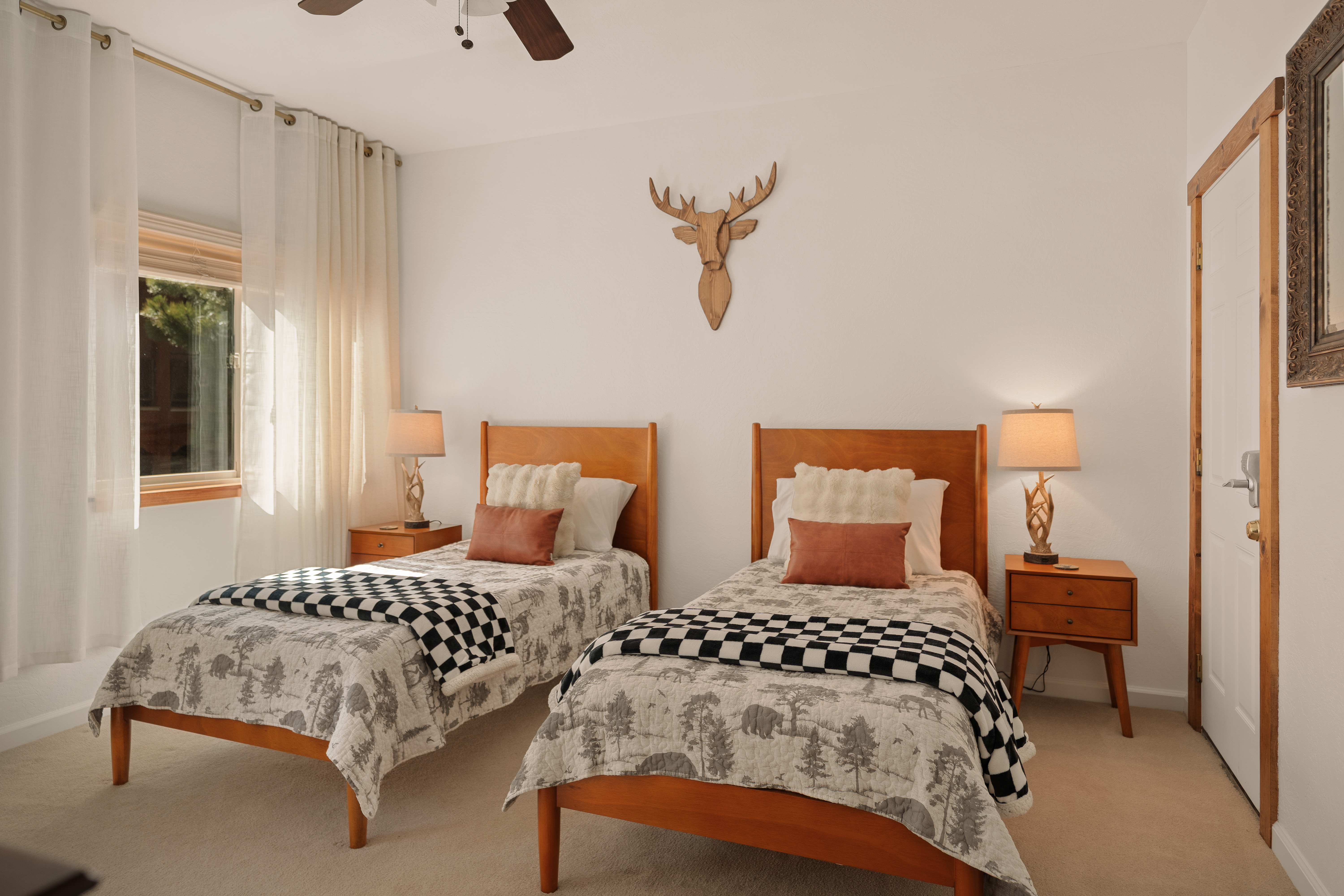 Cozy twin bedroom with rustic style and warm, inviting details