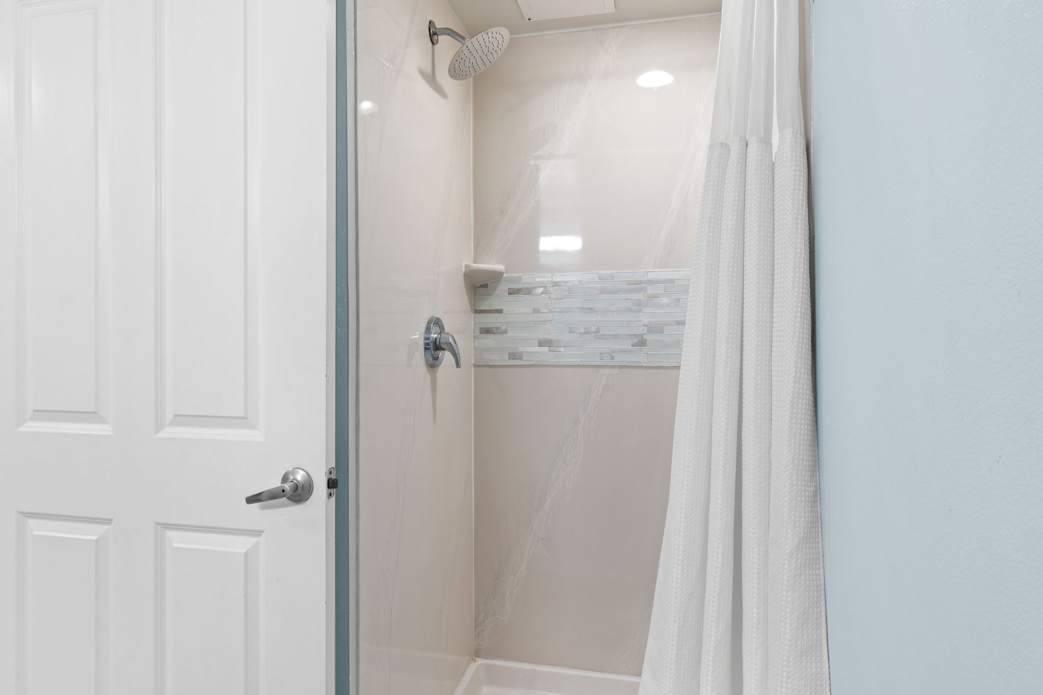 Modern walk-in shower with rainfall showerhead