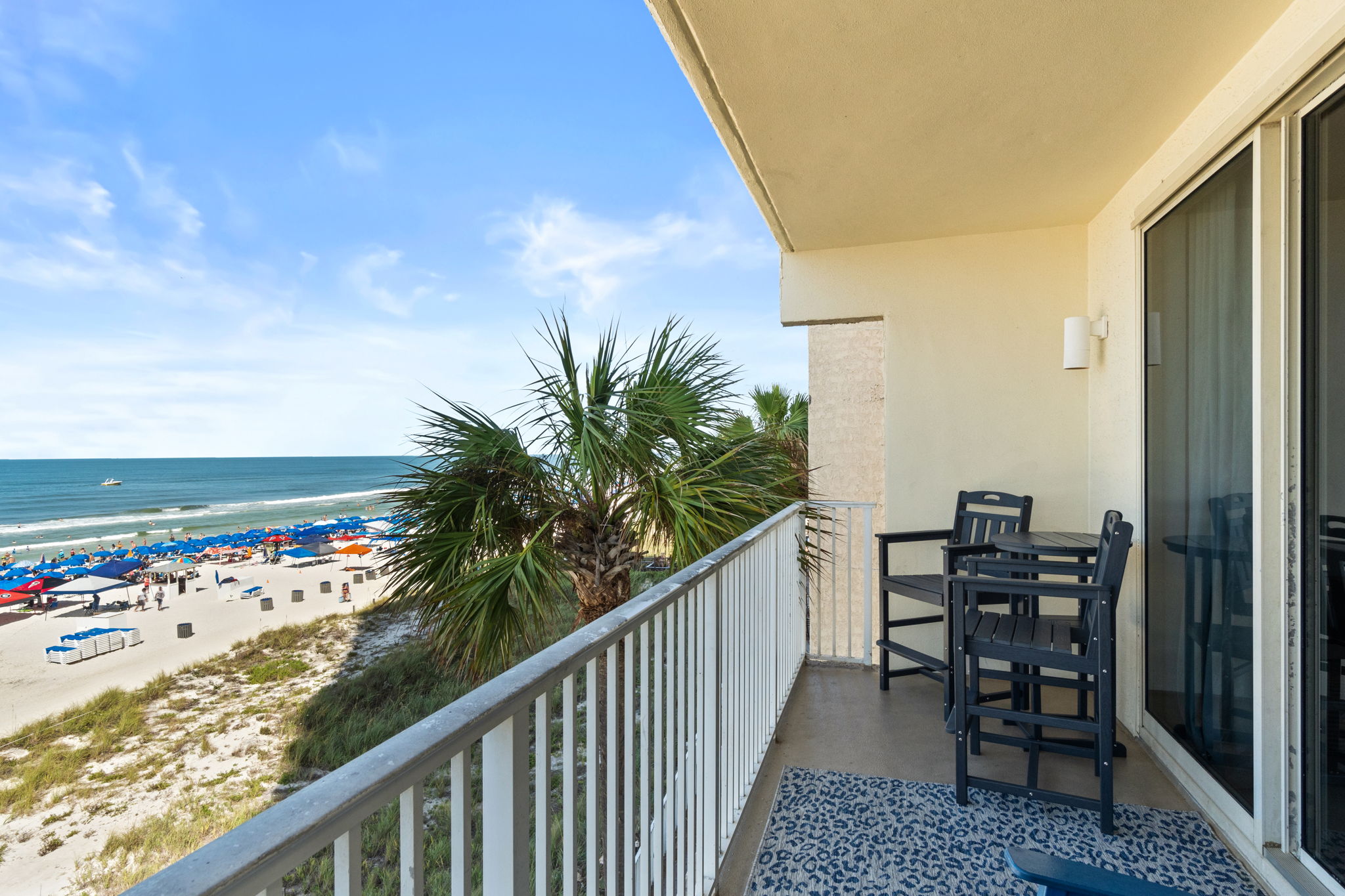 Private beachfront balcony with bar seating and ocean views