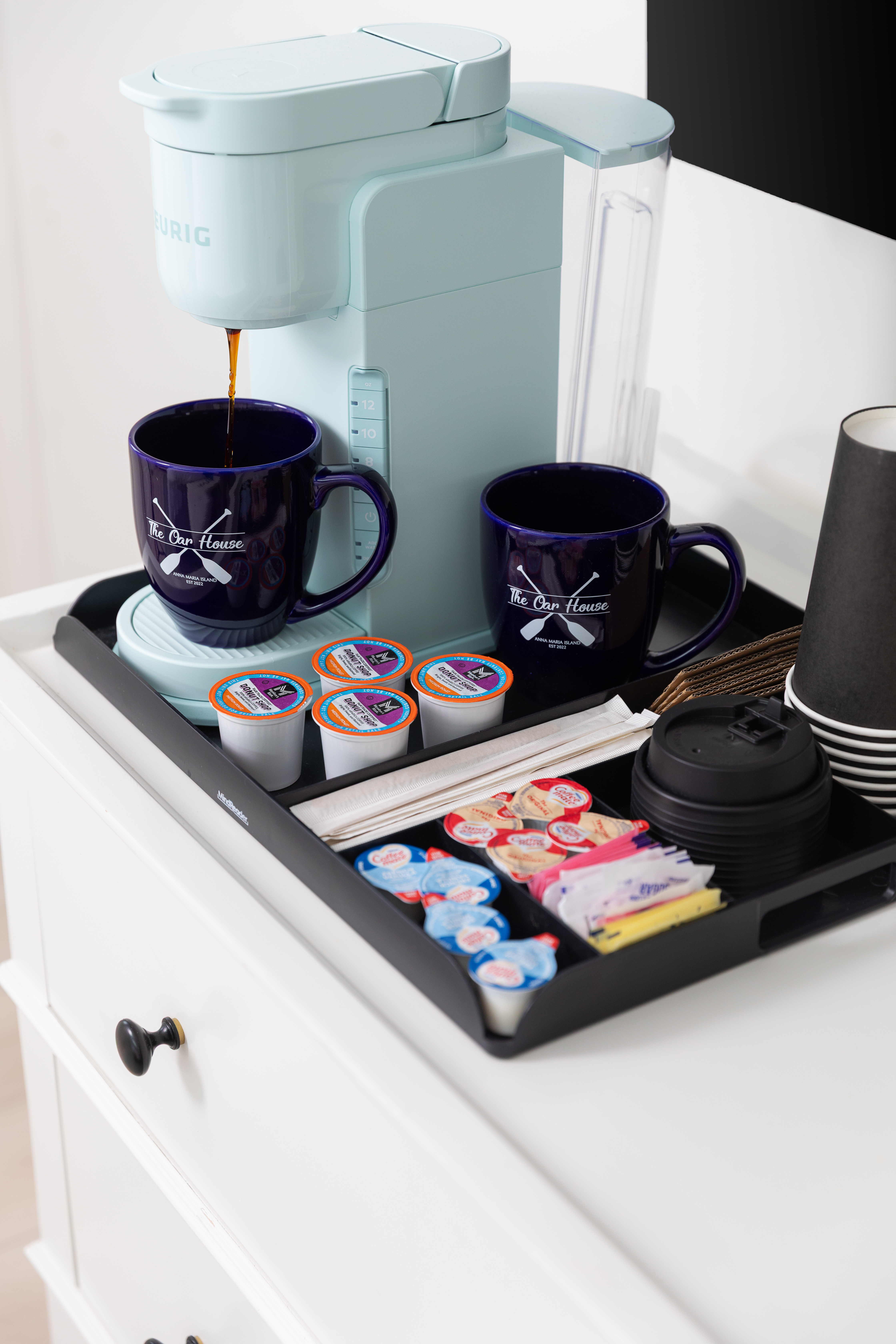 In-room coffee station with mugs, K-cups and sweeteners