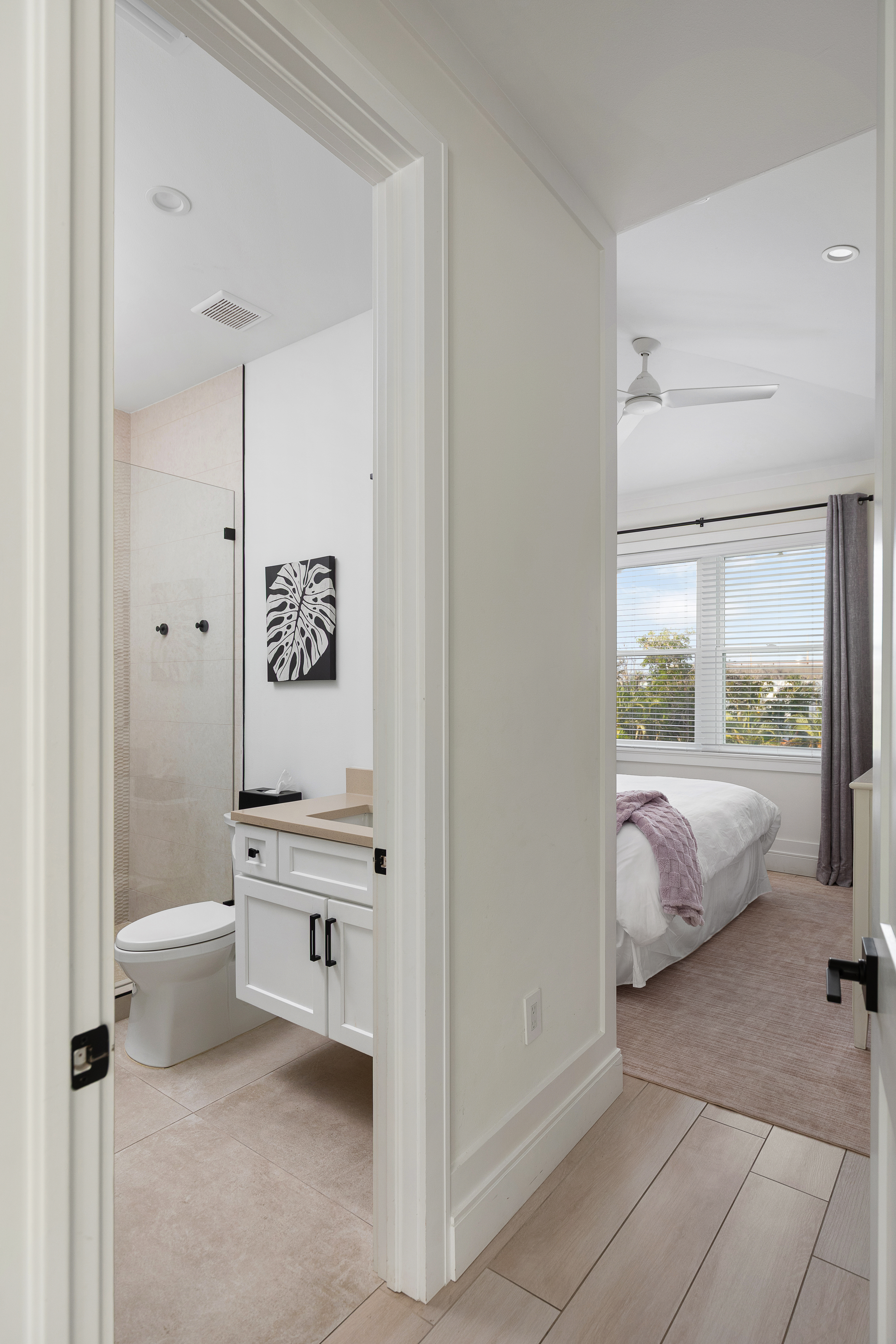 En-suite bath with designer finishes and a glass shower