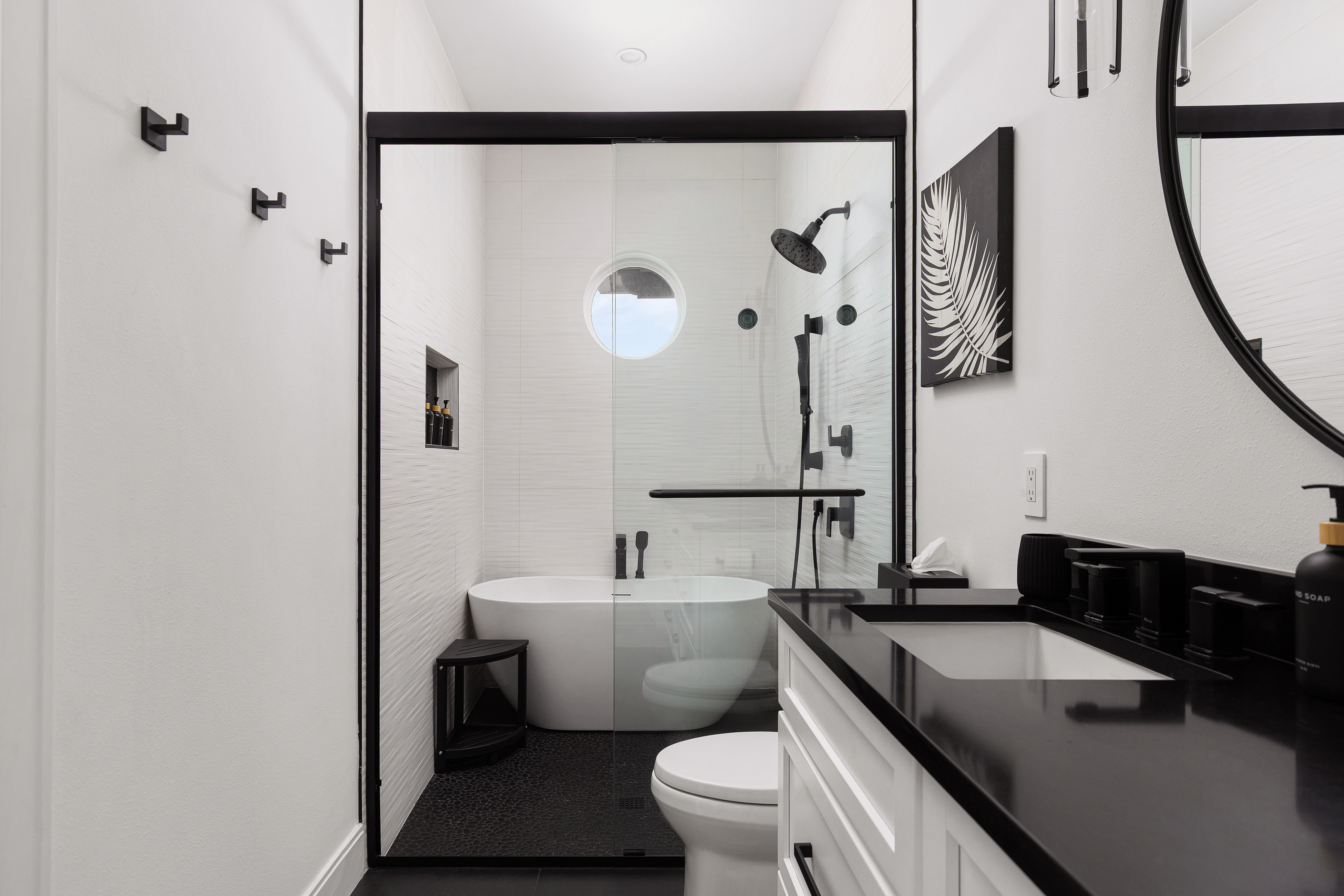 Spa-inspired bath with soaking tub and rainfall shower