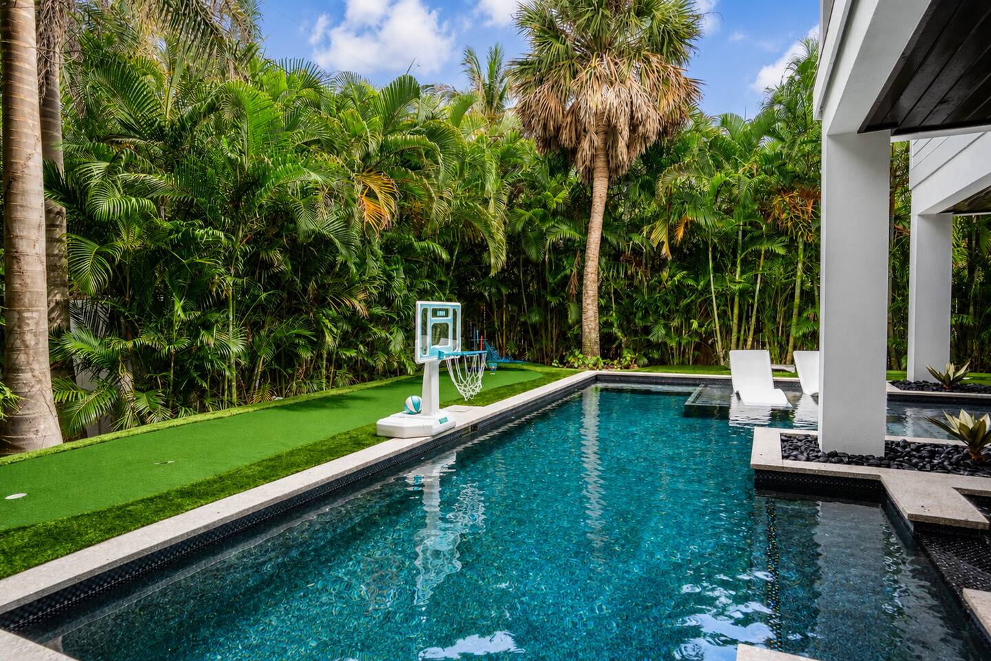 The Oar House heated pool and tropical landscaping