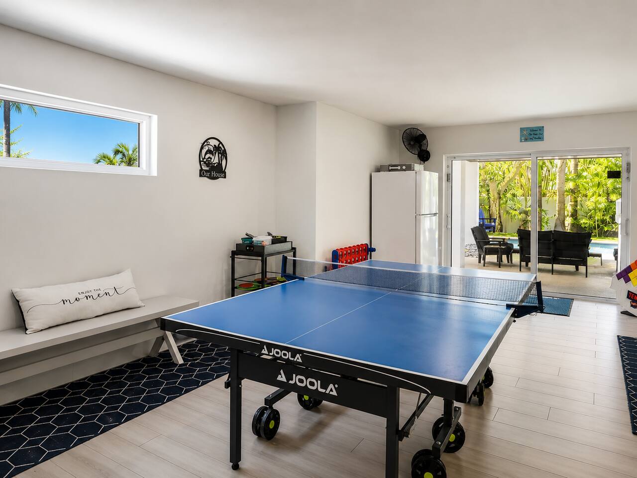 Blue ping pong table in game room