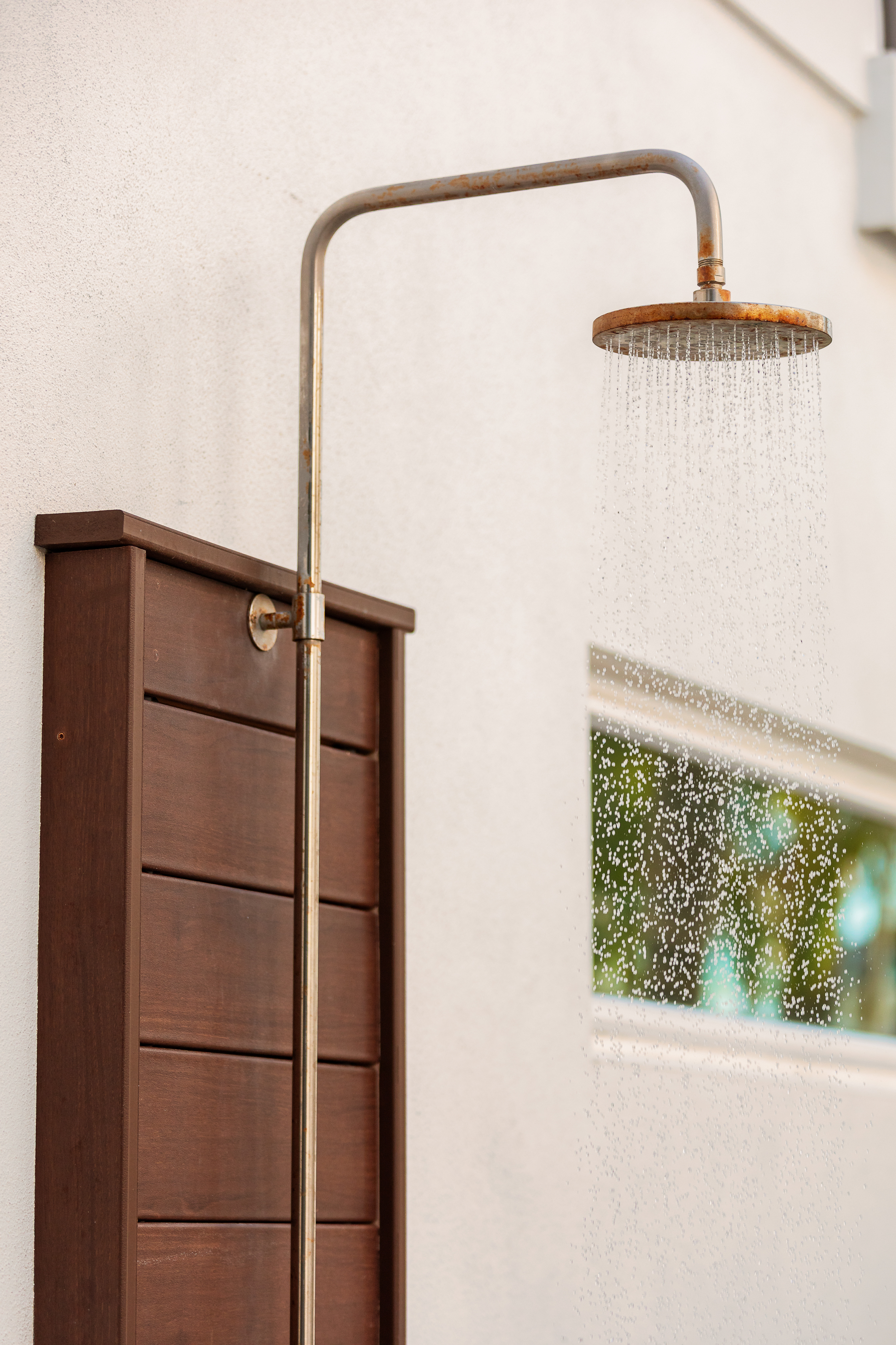 Private outdoor shower for rinsing off after the pool