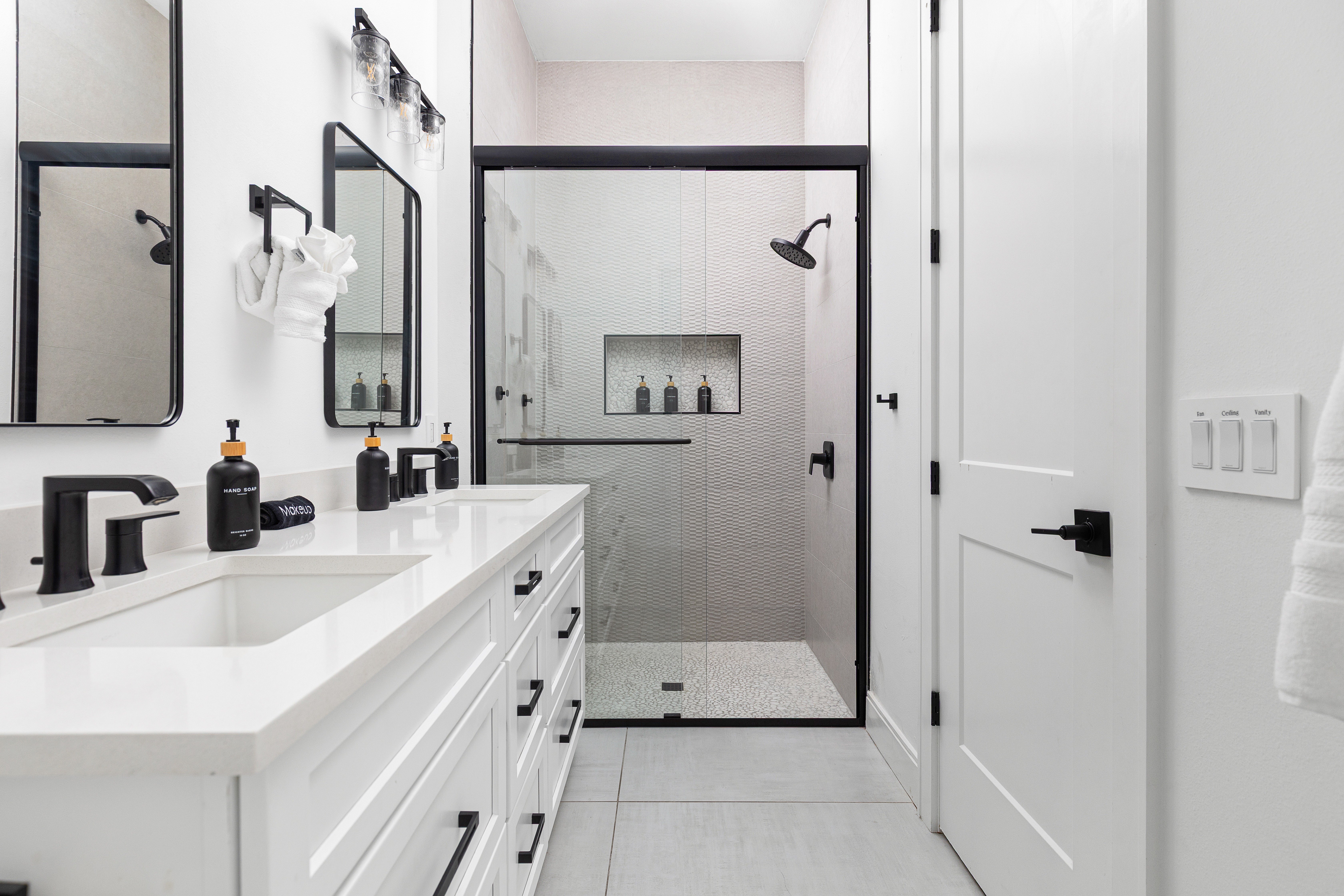 En-suite bath with double vanity and glass walk-in shower