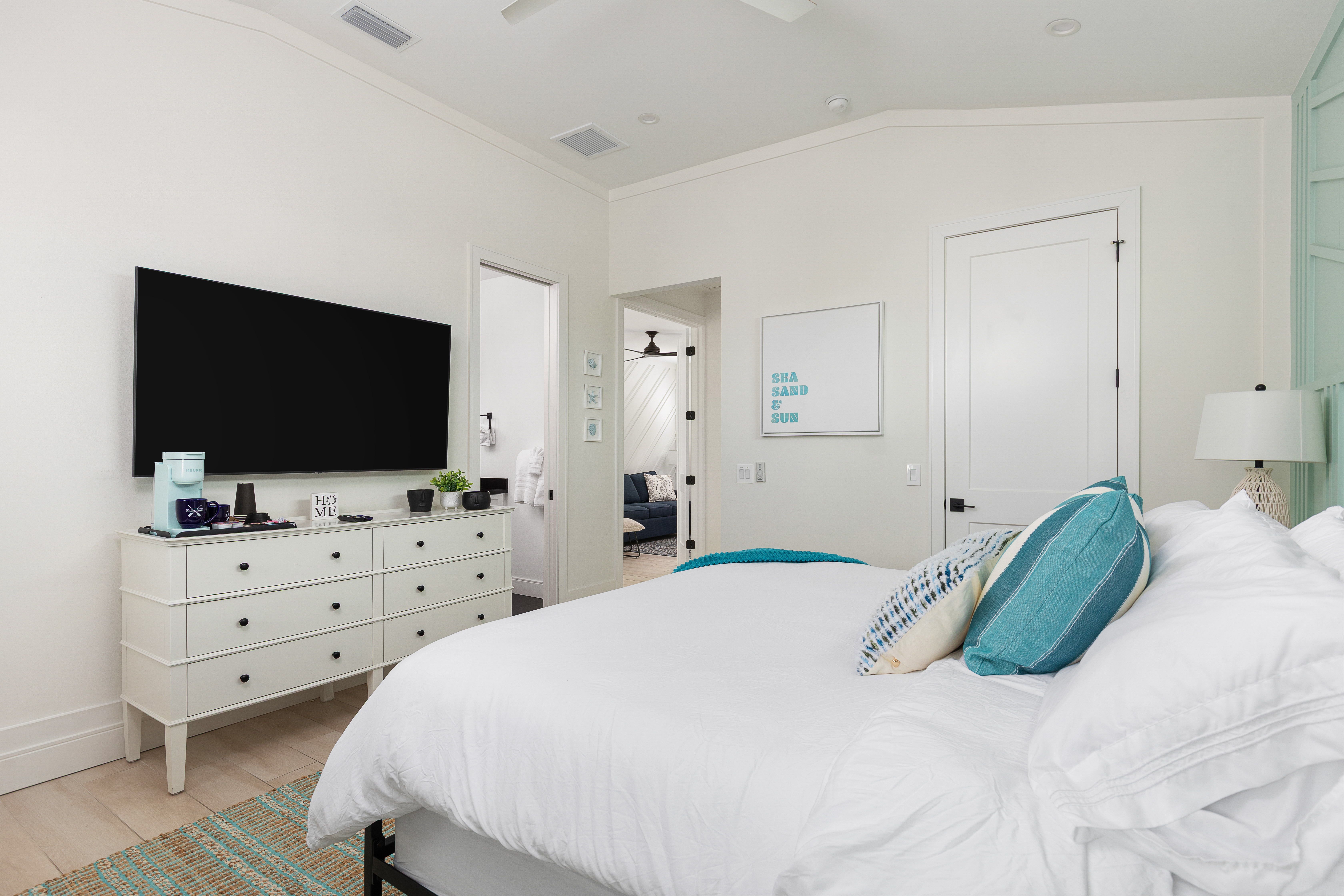 King bedroom with Roku TV, dresser storage and refined finishes