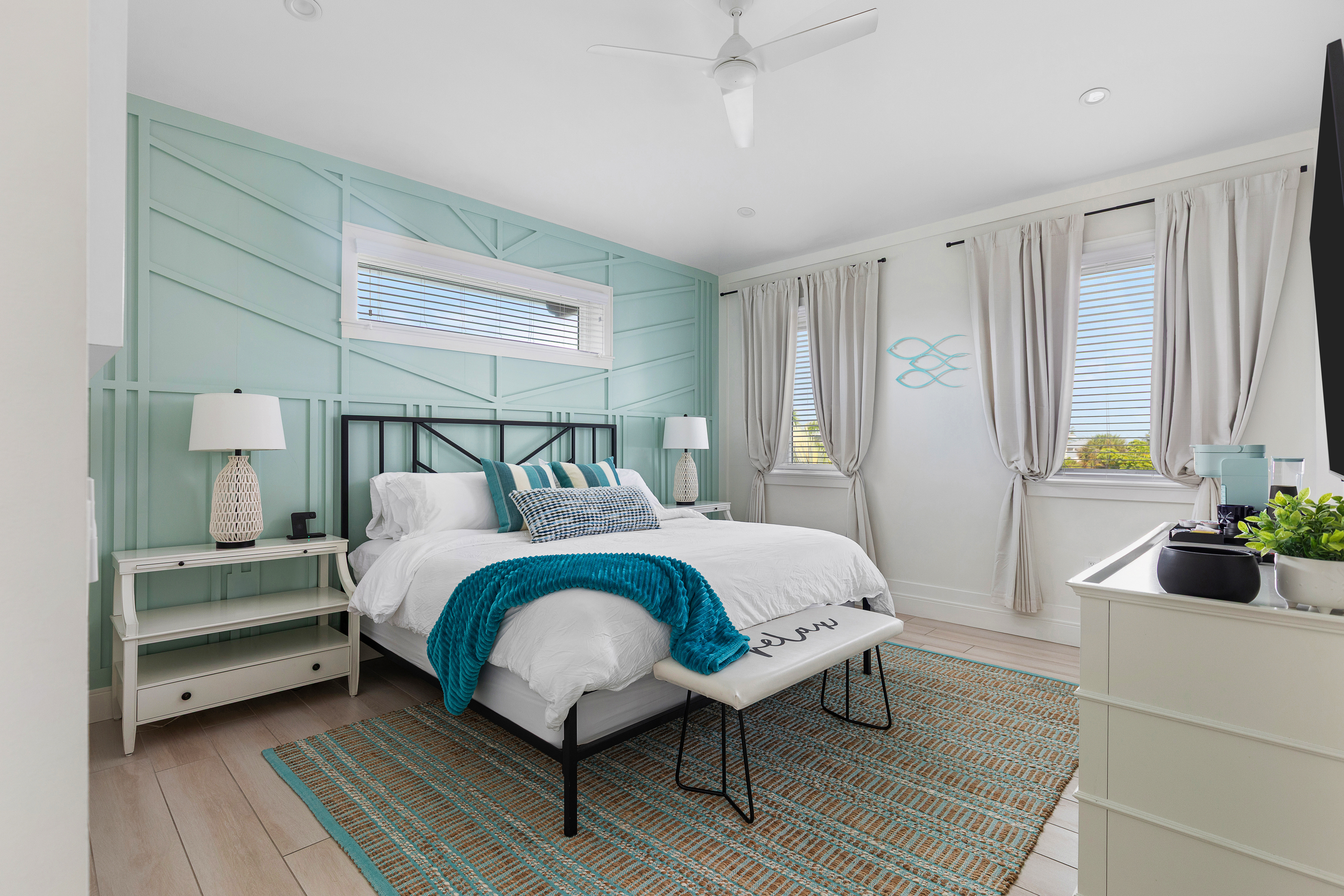 King bedroom, bright and airy, with Roku TV and bedside charging