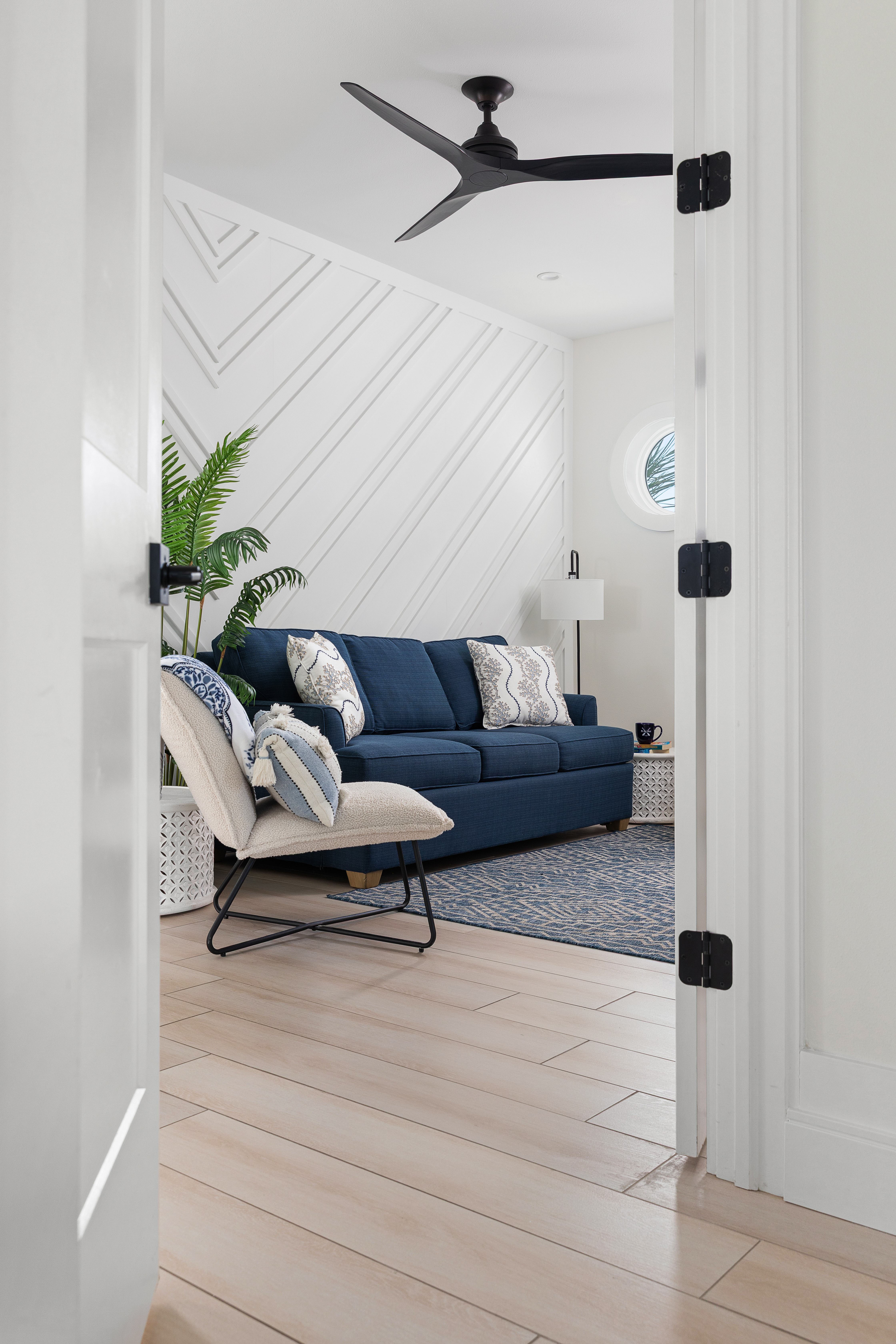 Landing seating area between three bedrooms with Roku TV