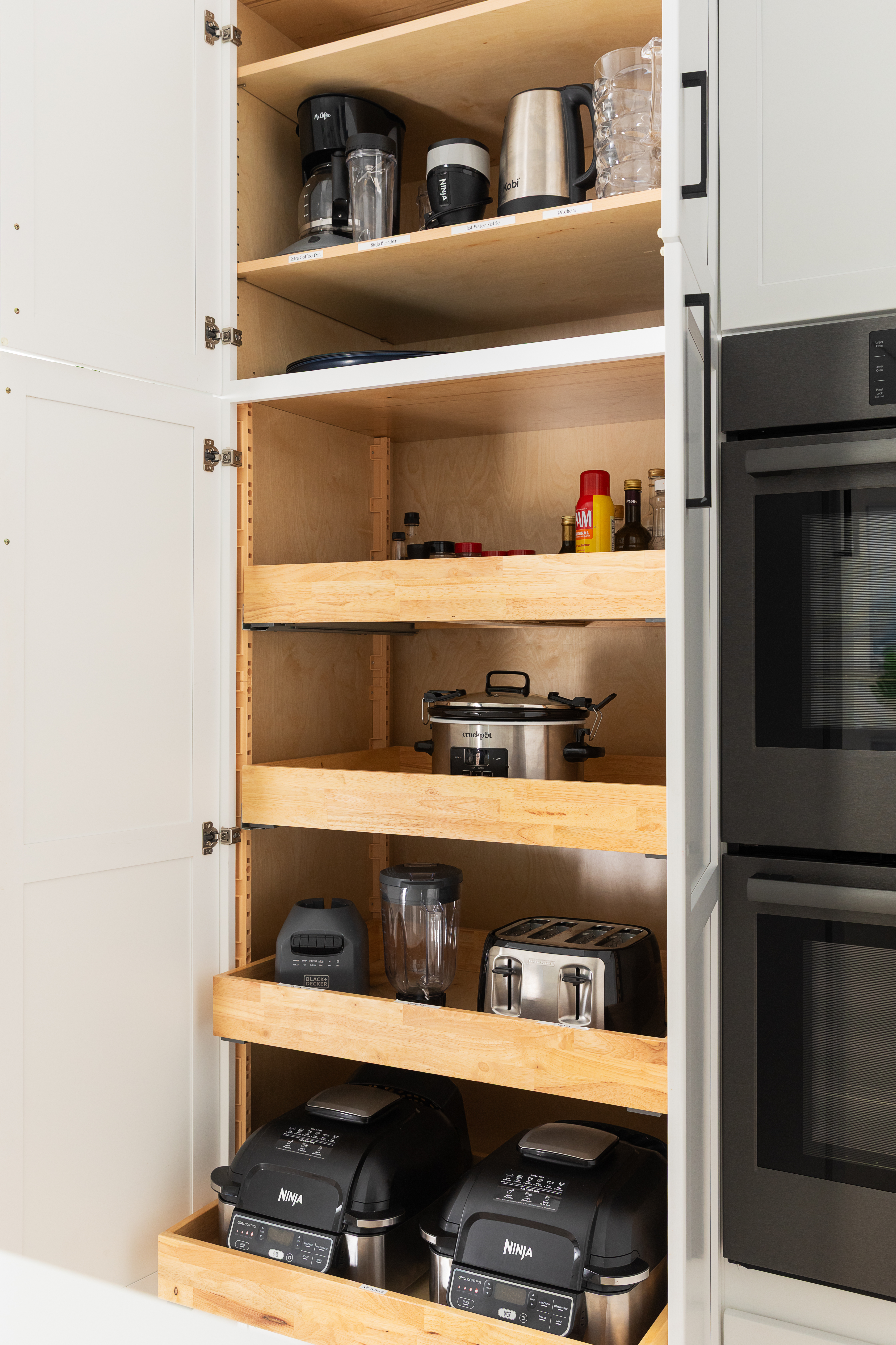 Pantry with air fryers, slow cooker, blender, toaster and kettle