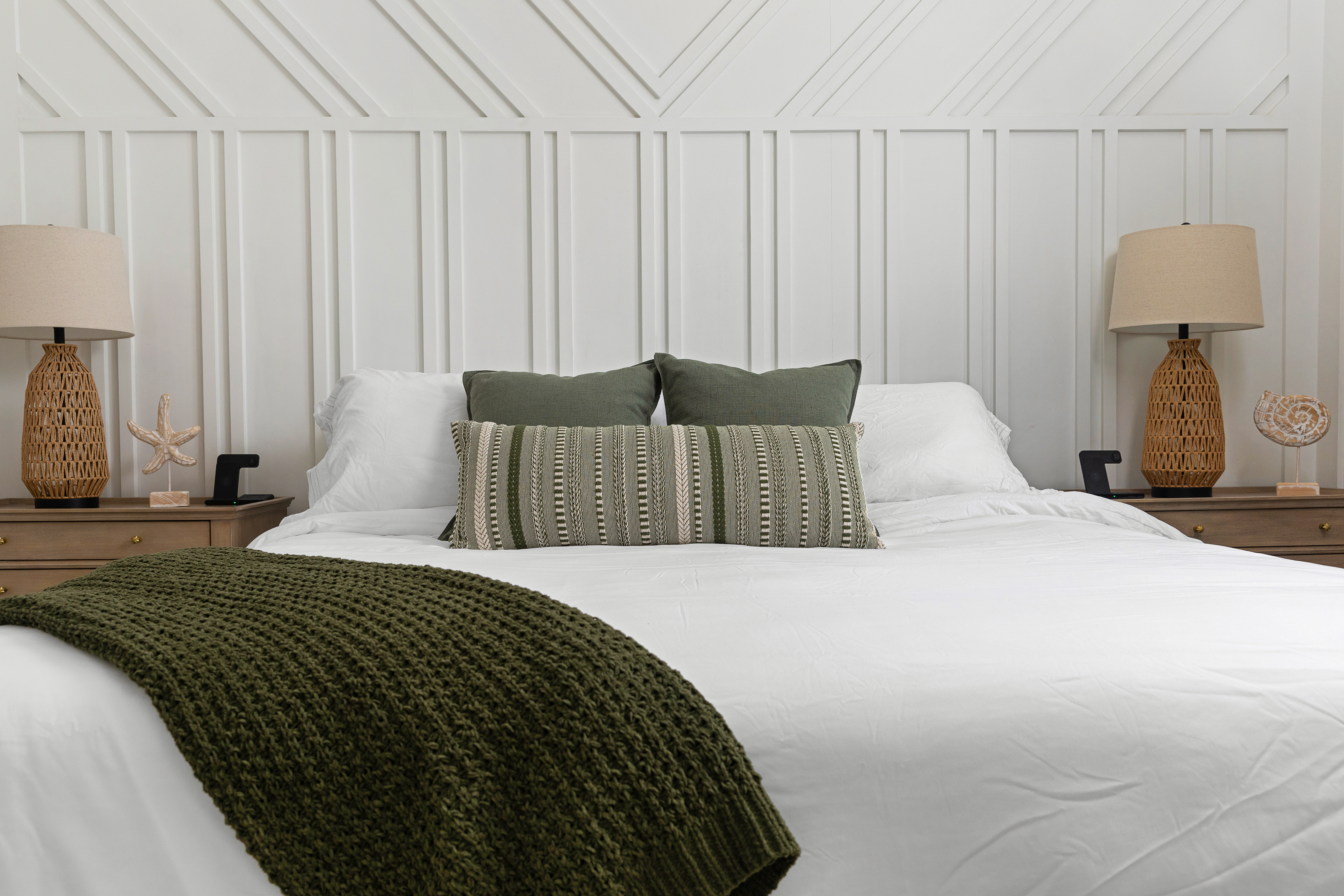 King bedroom with designer accent wall and coastal styling