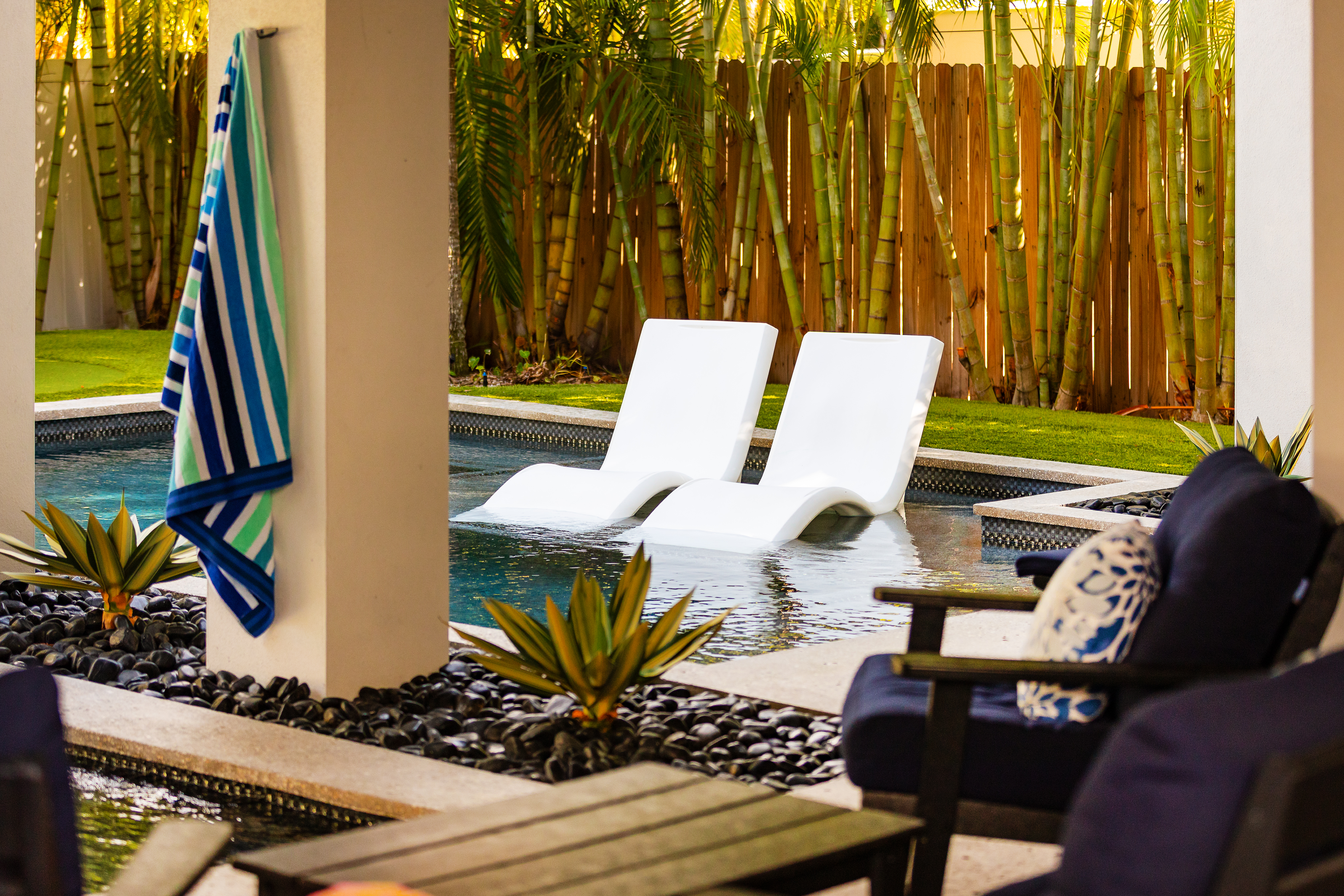 Poolside loungers set into the shallow end of the pool