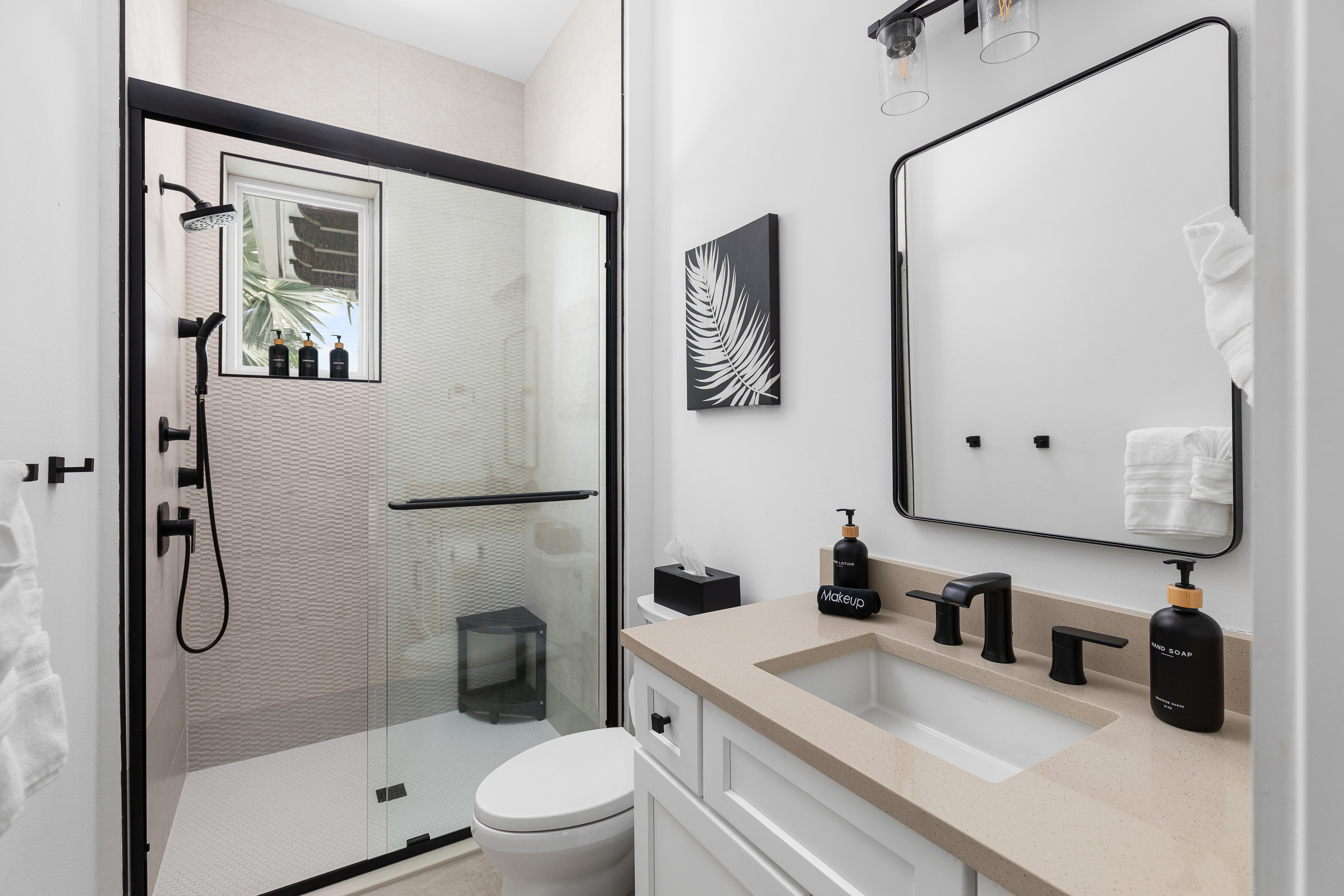 Bath stocked with body soap, shampoo, conditioner, hand soap and lotion