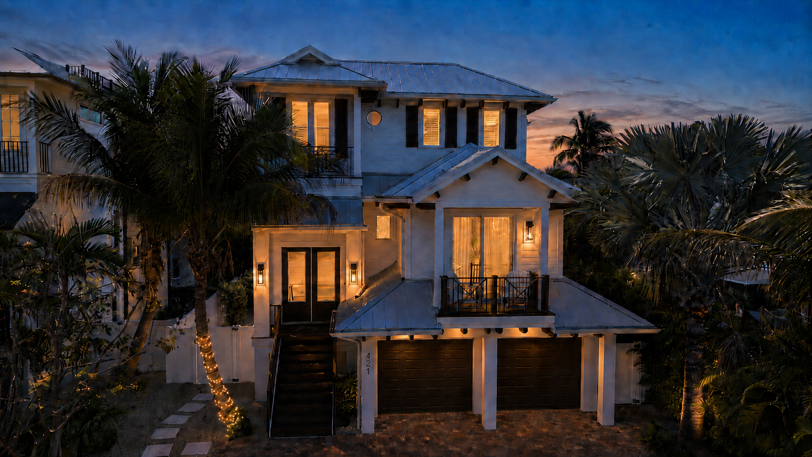 The Oar House at dusk, palms and sunset curb appeal