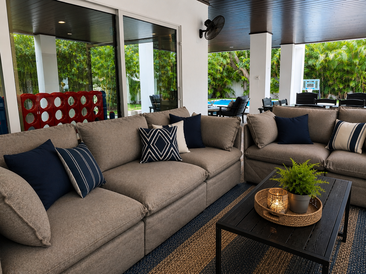 Covered poolside patio with lounge seating