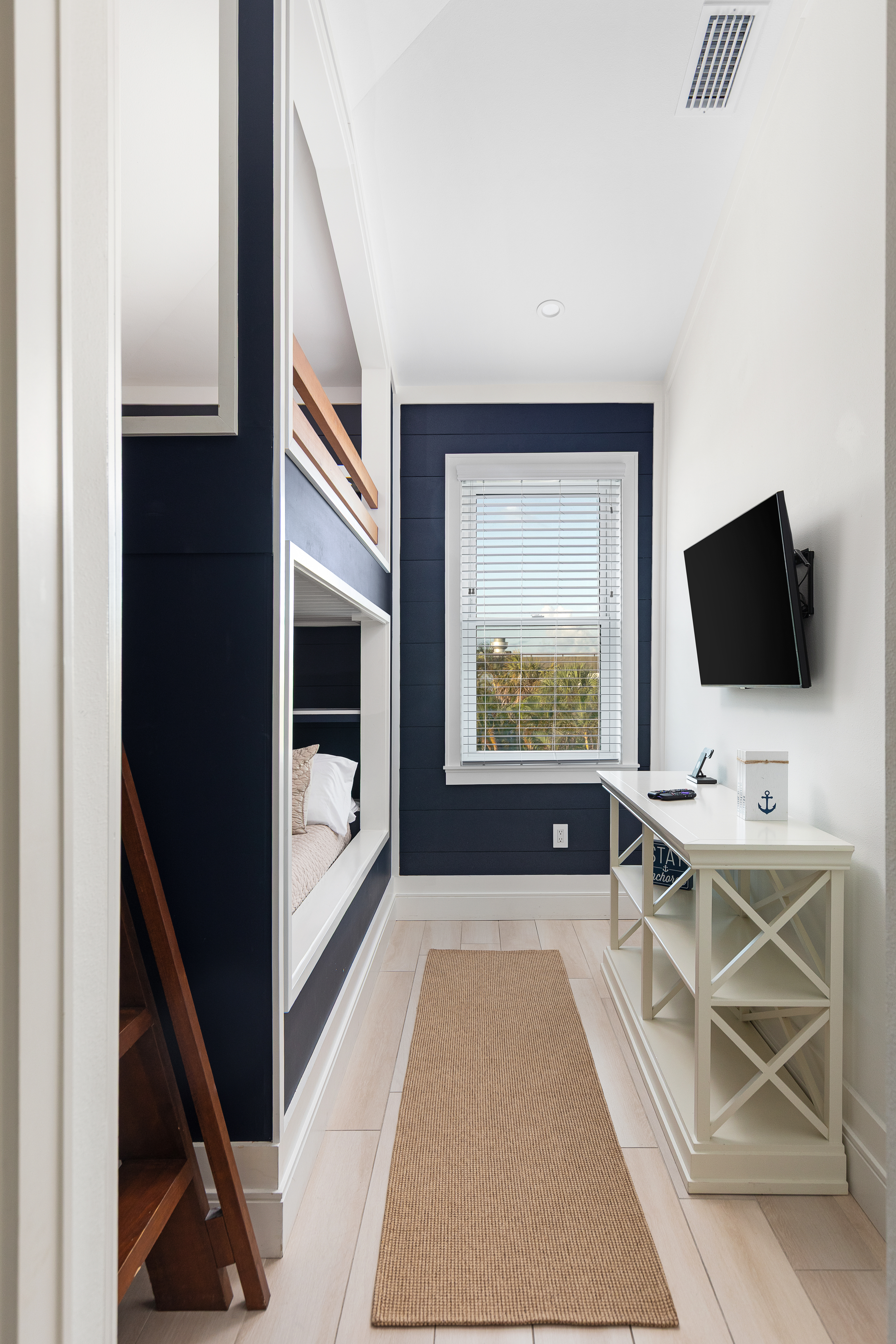 Bunk room with two full beds and a connected en-suite bath