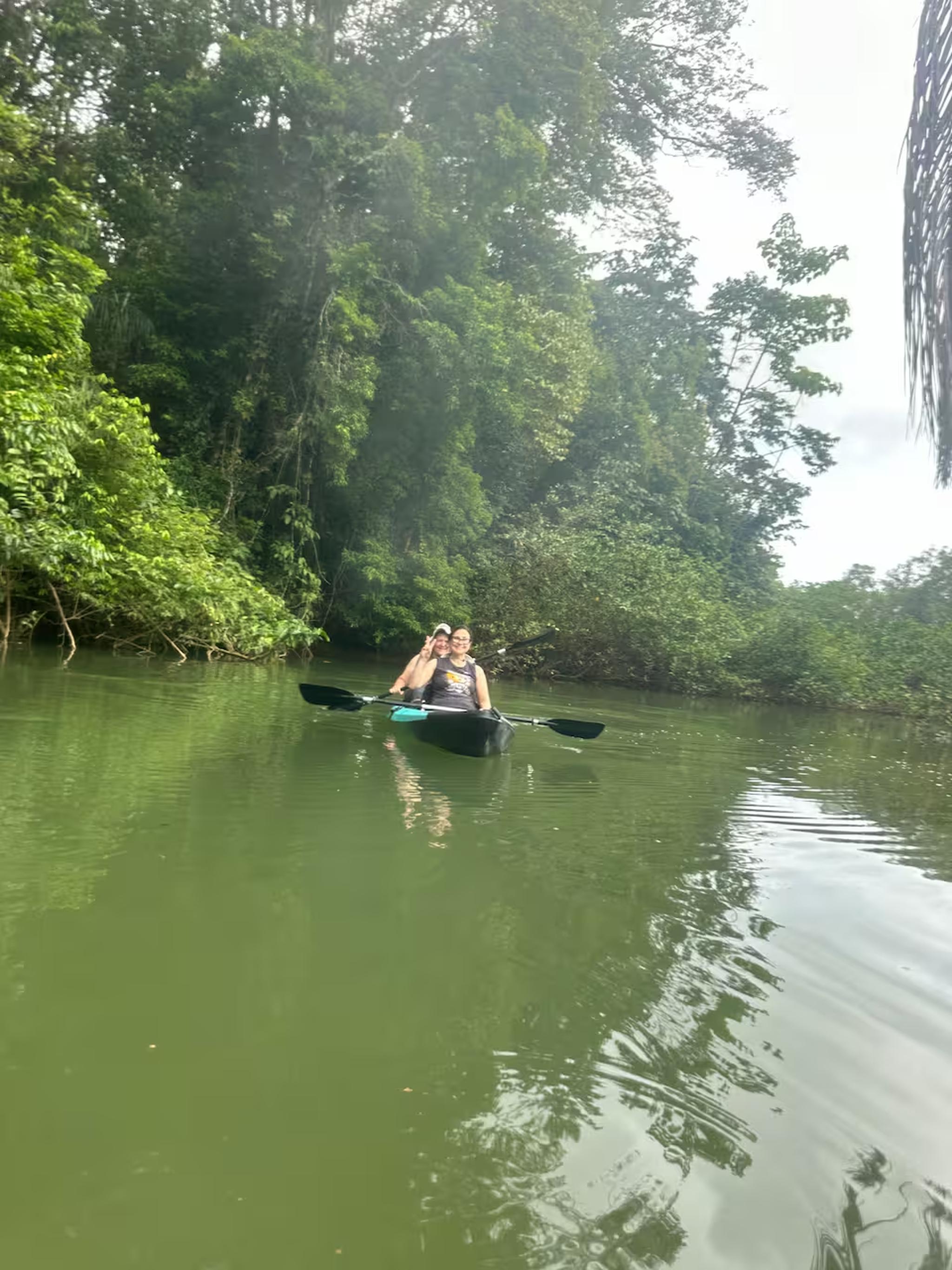 Peaceful jungle kayaking on a calm, scenic river