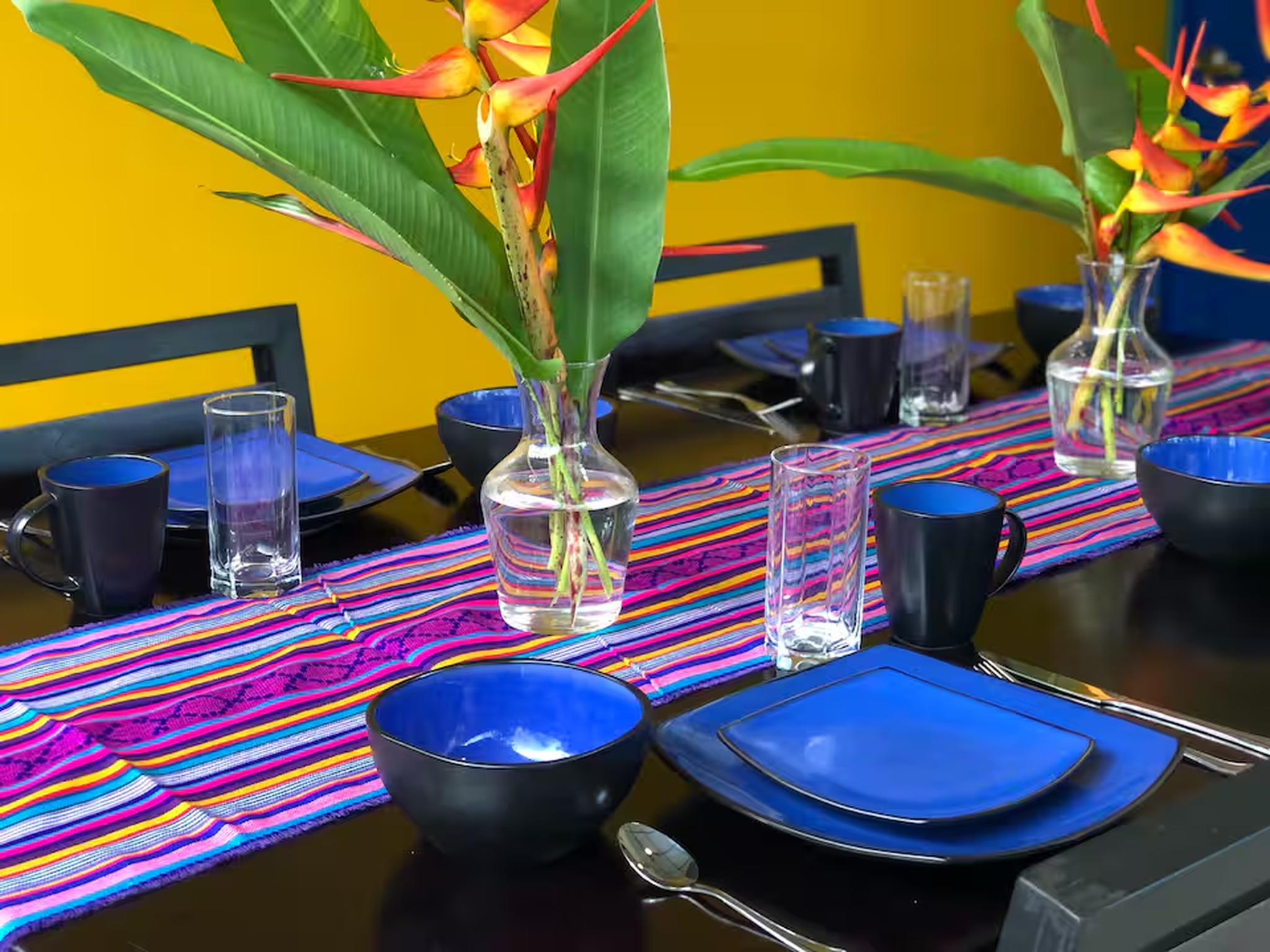 Colorful tropical dining setup with vibrant decor and seating for guests