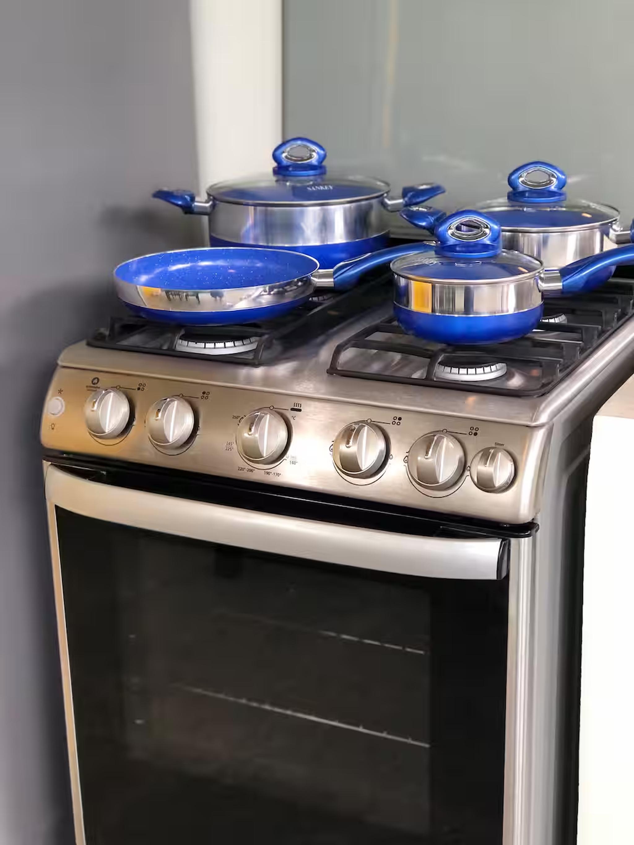 Fully equipped gas stove with stylish cookware for easy home cooking