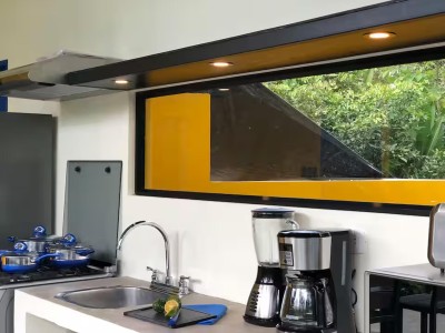 Bright modern kitchen with coffee station and lush garden-view window