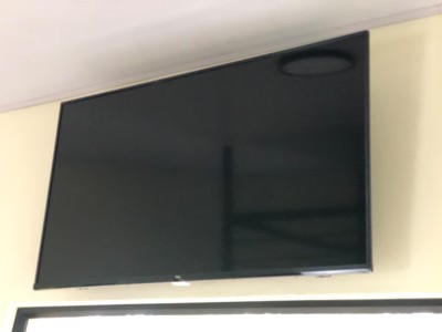Large wall-mounted TV for easy, comfortable in-room entertainment