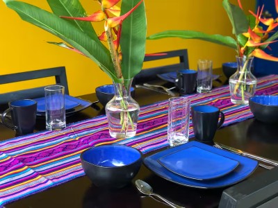 Colorful tropical dining setup with vibrant decor and seating for guests