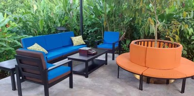Tropical garden lounge with vibrant seating and serene outdoor vibes